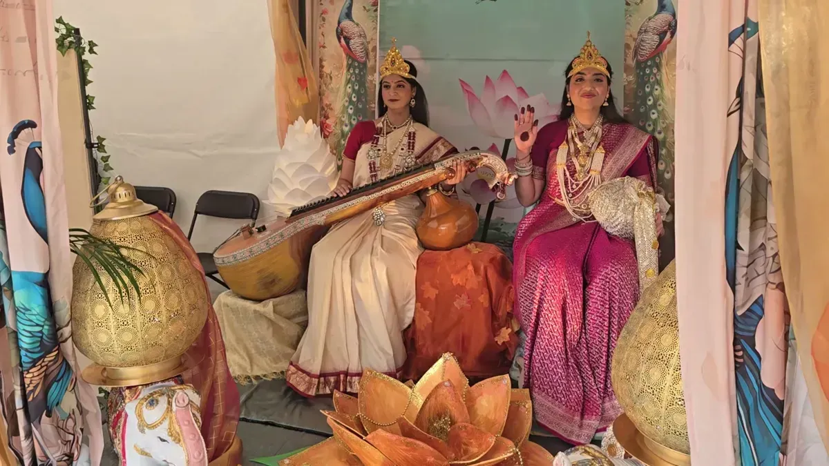 Performers dressed as Saraswati and Lakshmi in the Glimpse of Goddesses tent