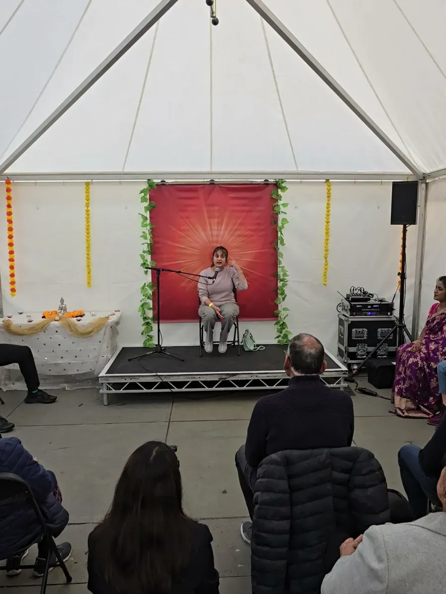 Visitors seated for a guided meditation session