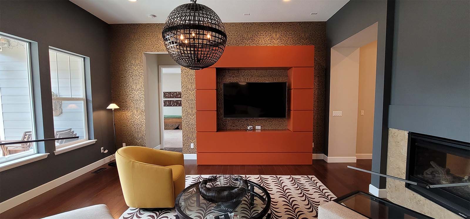 A living room with a fireplace and a flat screen tv