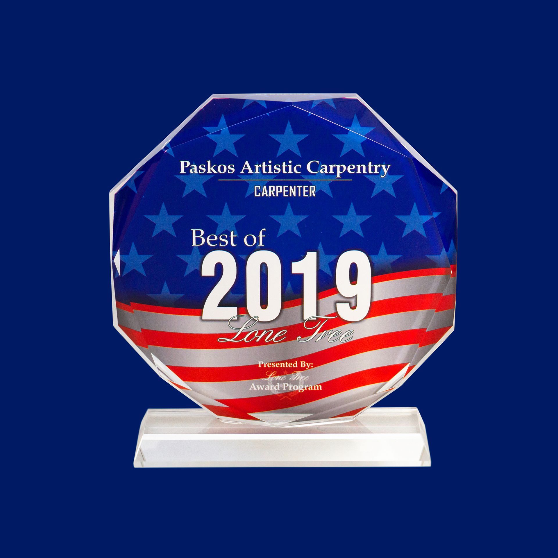 Blue award plaque with stars and red stripes reading “Best of 2019” on a white base