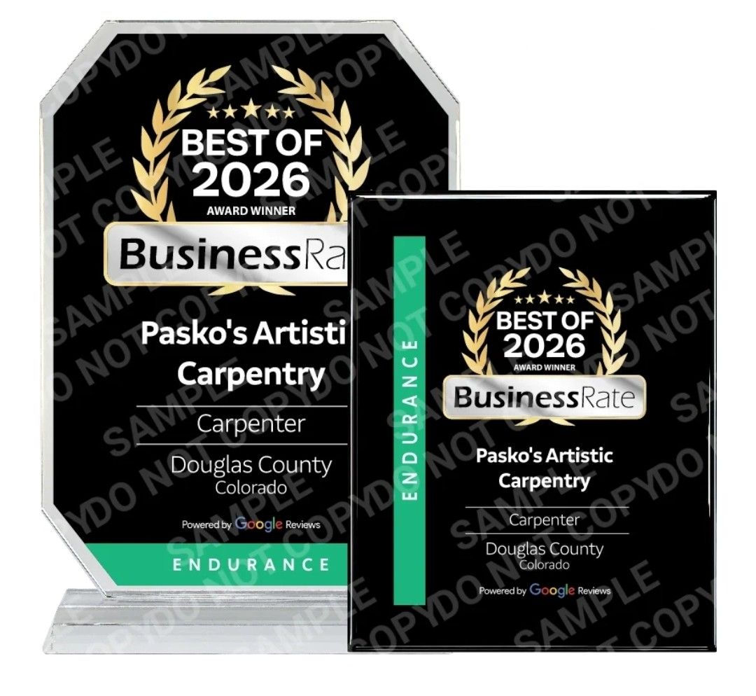 BusinessRate Best of 2026 awards for Pasco's Artistic Carpentry on black and green plaques