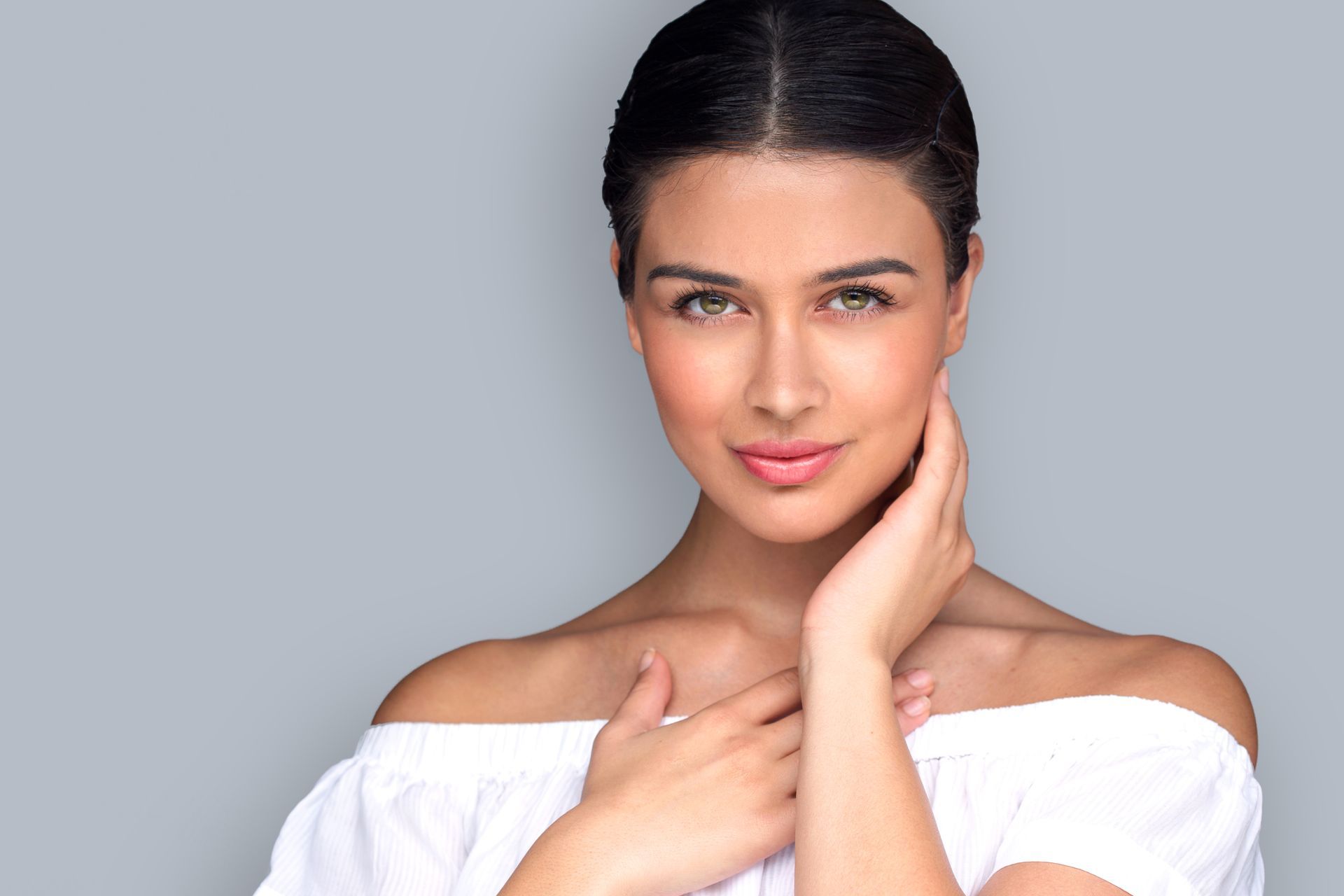 woman with beautiful skin wearing a white shirt