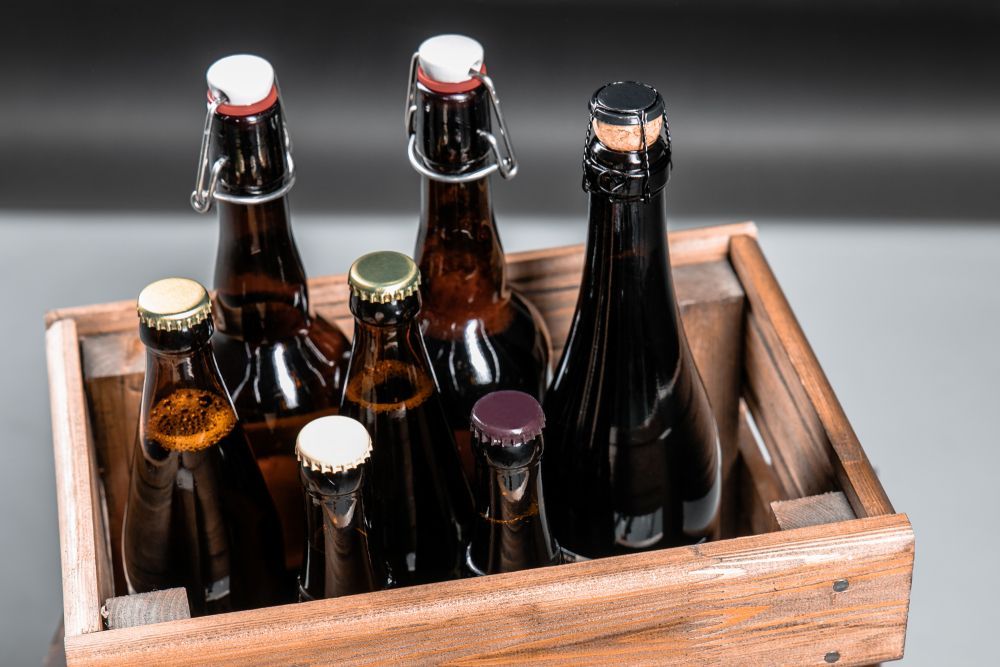 A Wooden Crate Filled With Empty Beer Bottles — Howard Springs Supermarket In Howard Springs, NT