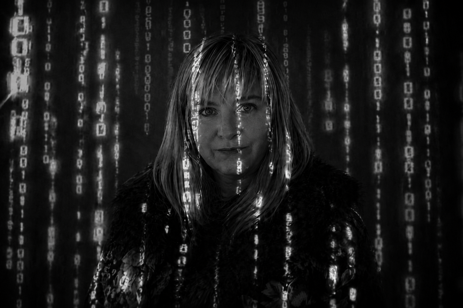 Person standing amid falling binary code in a dark, Matrix-style scene