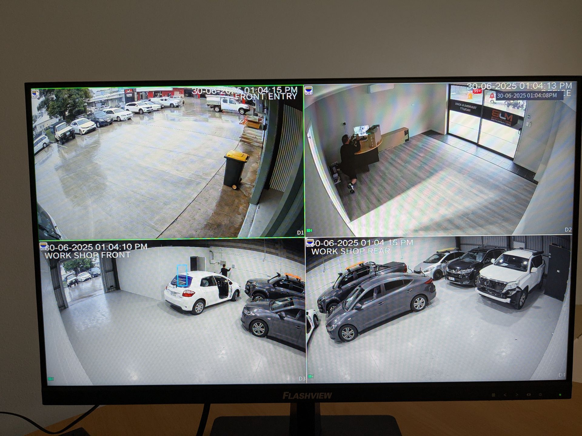 CCTV footage of four cameras looking over a parking garage— Direct Connect Services In Woombye, QLD