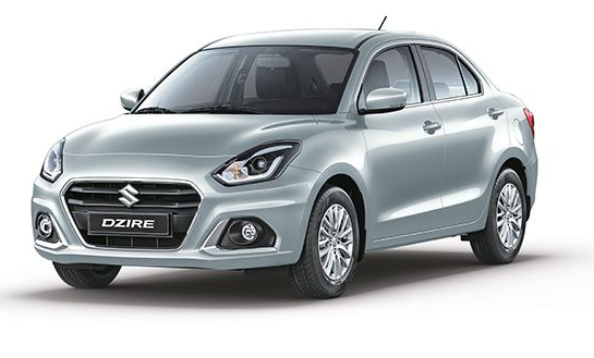 Sedán Suzuki Dzire plateado, vista frontal, sobre fondo blanco.