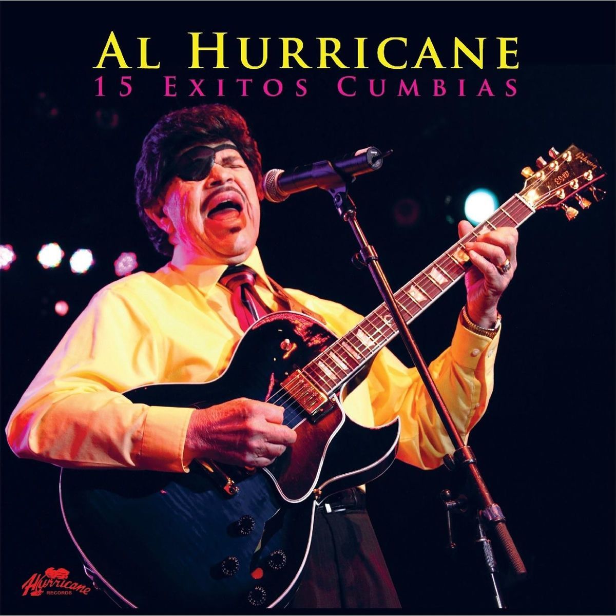 Al Hurricane playing guitar and singing on stage, wearing an eyepatch and a bright yellow shirt. The album cover reads