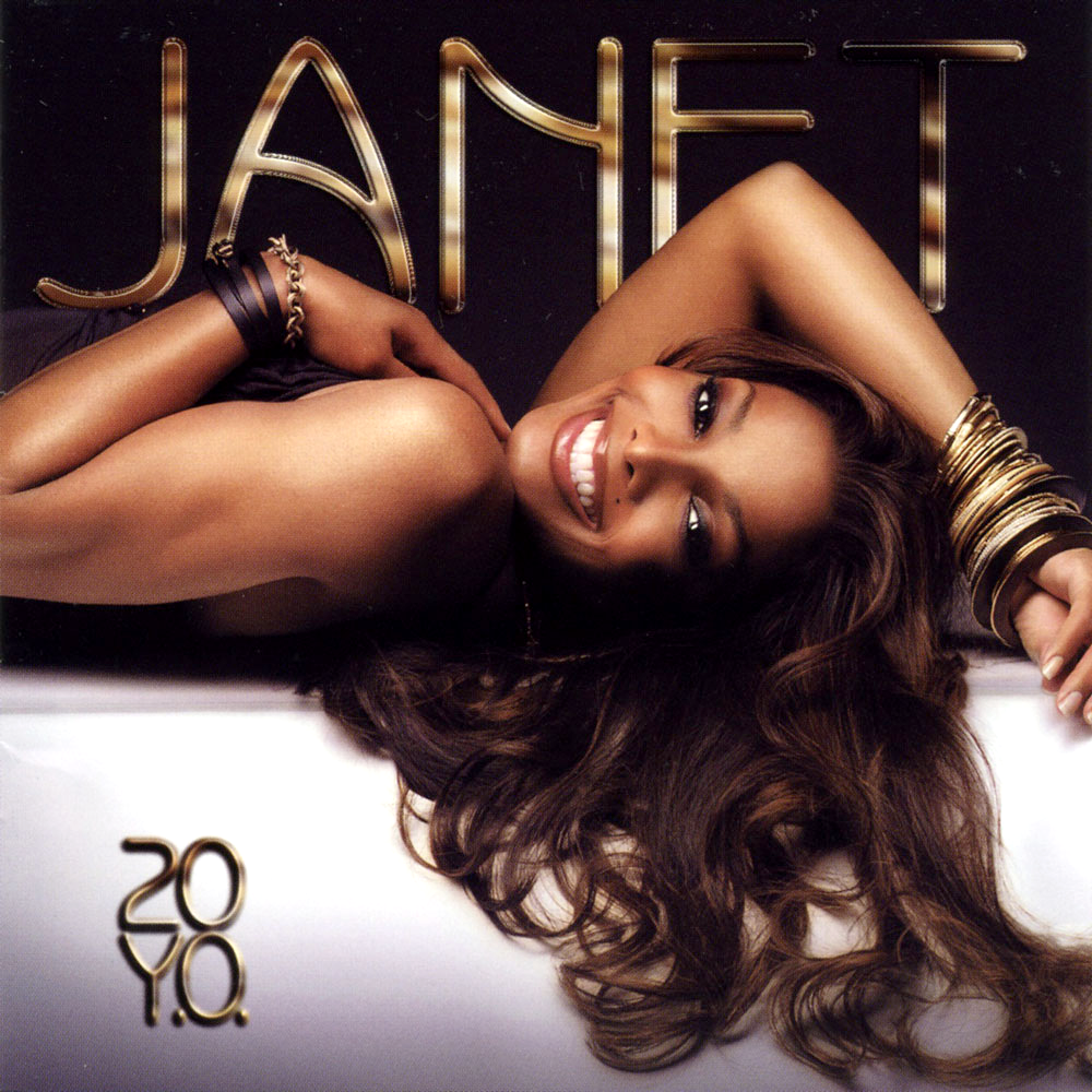 Janet Jackson, smiling and reclining, wearing gold bracelets, brown hair, on a reflective surface. The album name