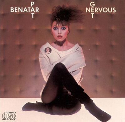 Pat Benatar album cover: Singer in a straitjacket, arms crossed, with wild hair and a worried expression.