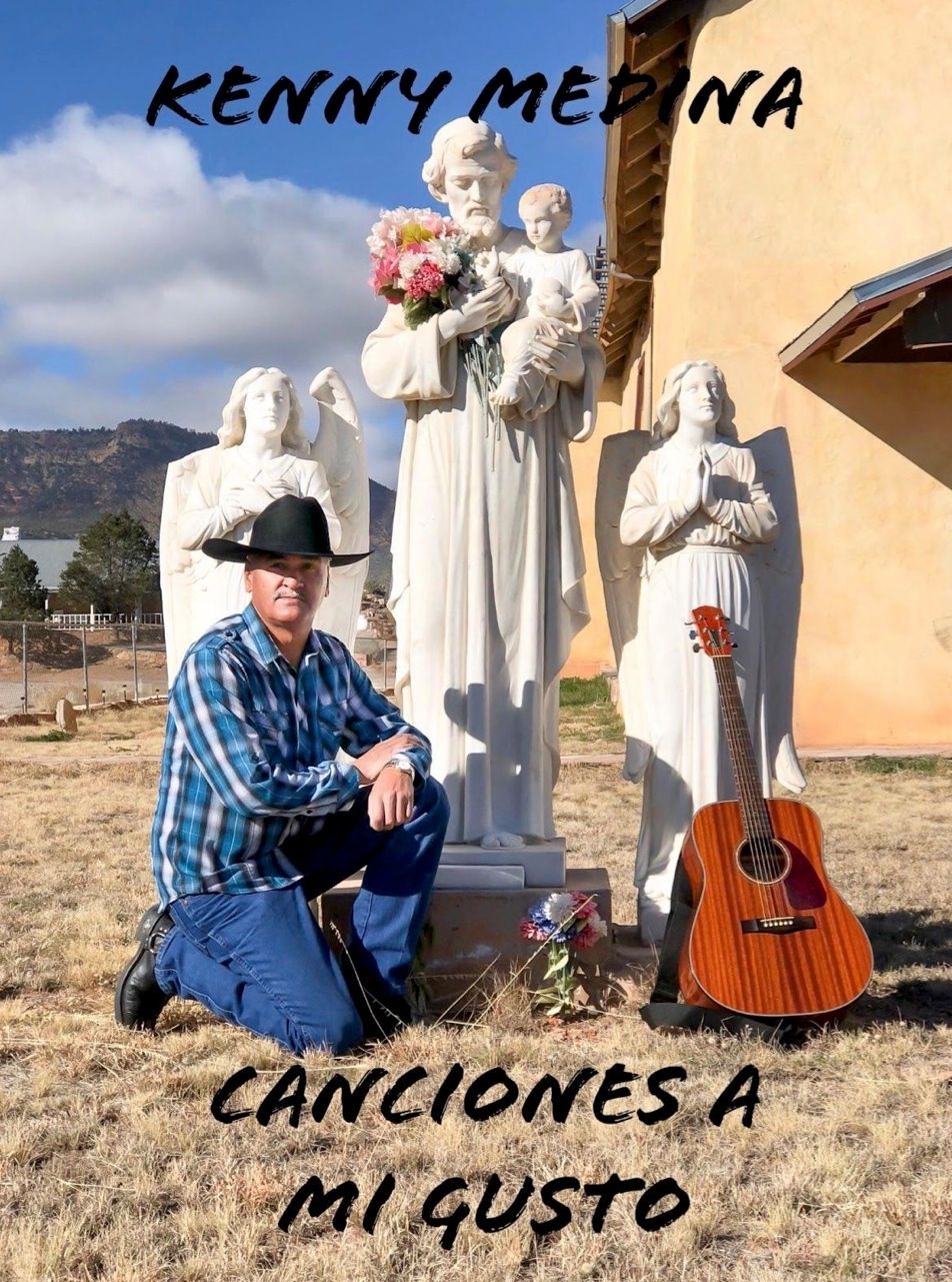 Kenny Medina album cover: Man kneels by statues, holding guitar. Title