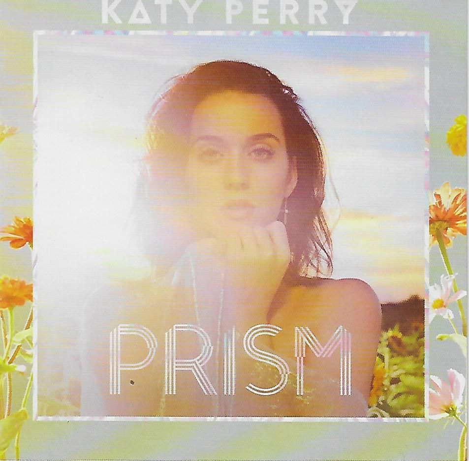 Katy Perry, PRISM album cover. Perry in sunlight, surrounded by flowers.