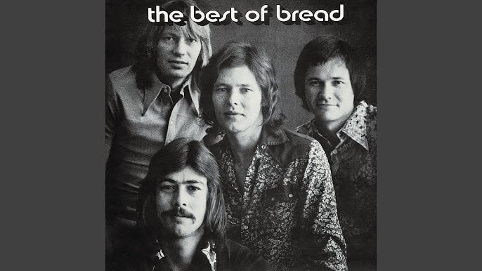 Black and white photo: The band Bread poses, in casual attire, for