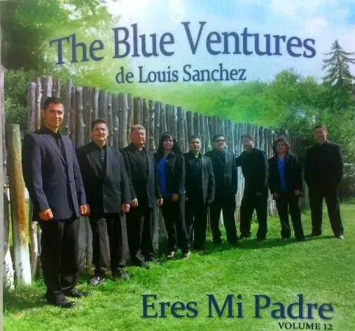 Album cover: The Blue Ventures de Louis Sanchez, a group of people in formal wear, standing on grass near a wooden fence. Title: Eres Mi Padre, Volume 12.