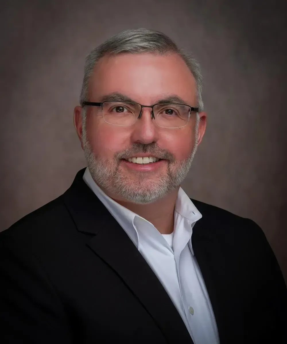 Fiduciary Paul Boggs in a suit and tie.