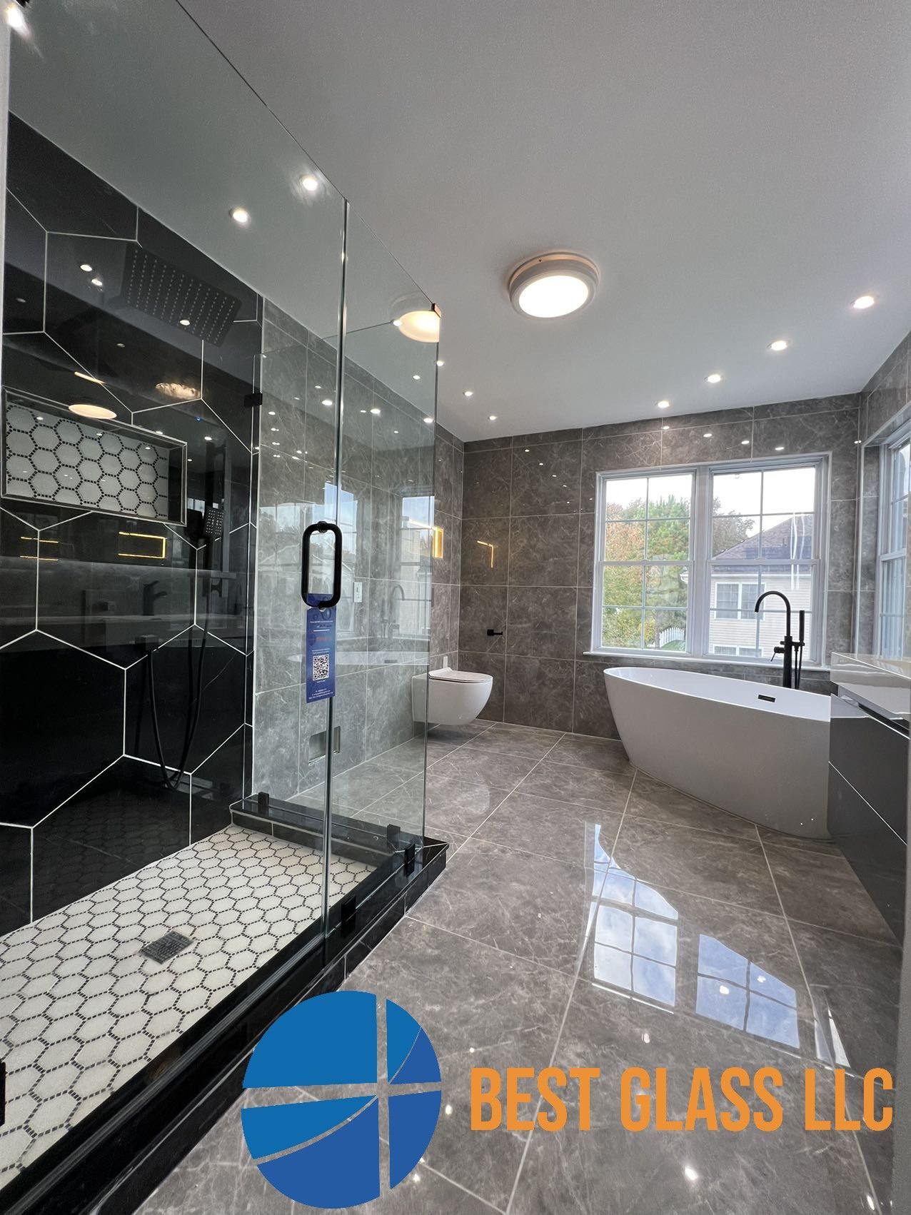 A bathroom with a walk in shower , tub , sink and toilet.