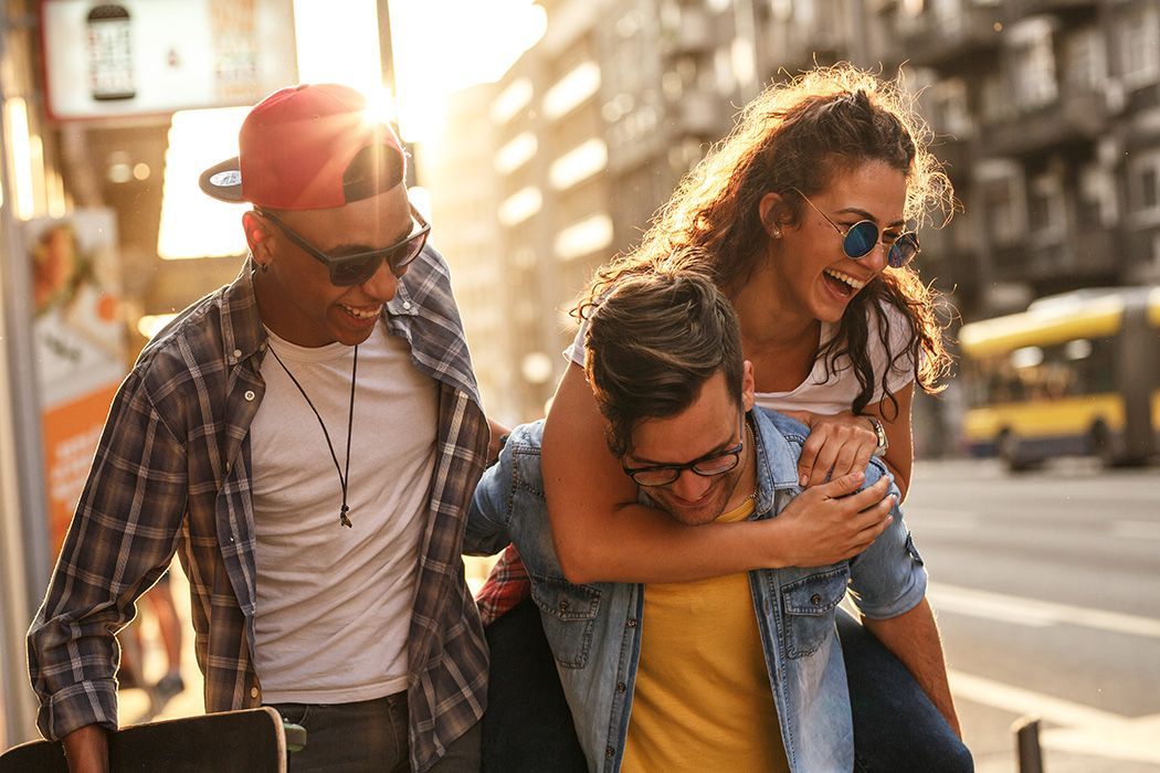 friends having fun walking downtown