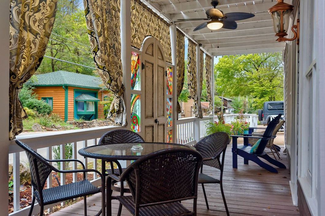beautiful cottage porch with furniture