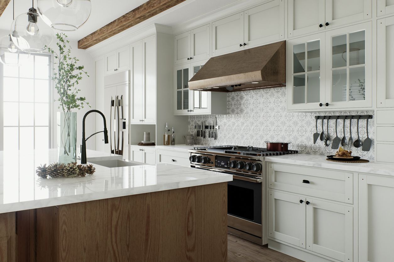 Bright white kitchen with wood island, farmhouse sink, stainless stove, and copper range hood