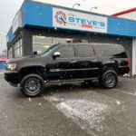 black jeep side view near gate | Steve's Tire & Auto Repair