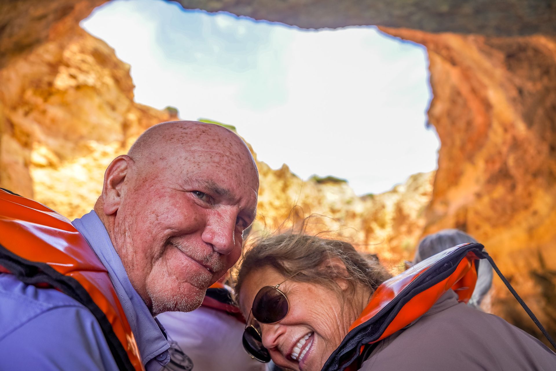 Happy couple on a boat tour inside Benagil Cave, Algarve
