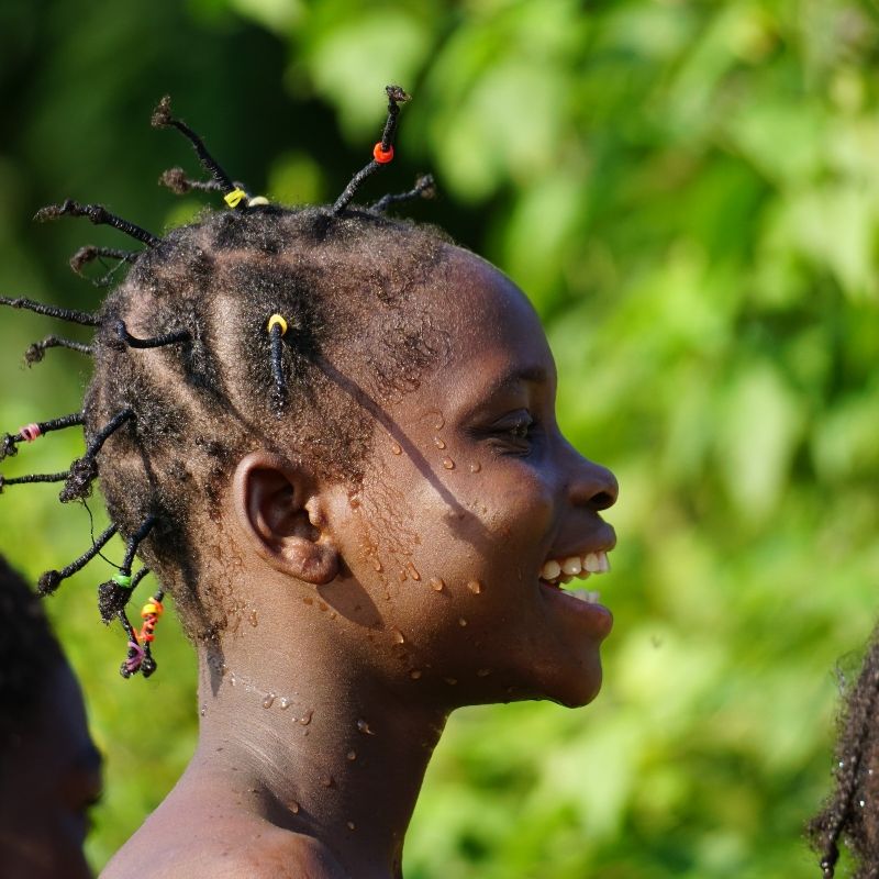 A young girl with braids in her hair is smiling. 
The Republic of the Congo invites exploration through its dense rainforests, thriving wildlife, dynamic cities, and rich cultural traditions—all in one unforgettable destination.
Discover Congo with Africa DMC’s trusted network for your local tour operator and travel agent.