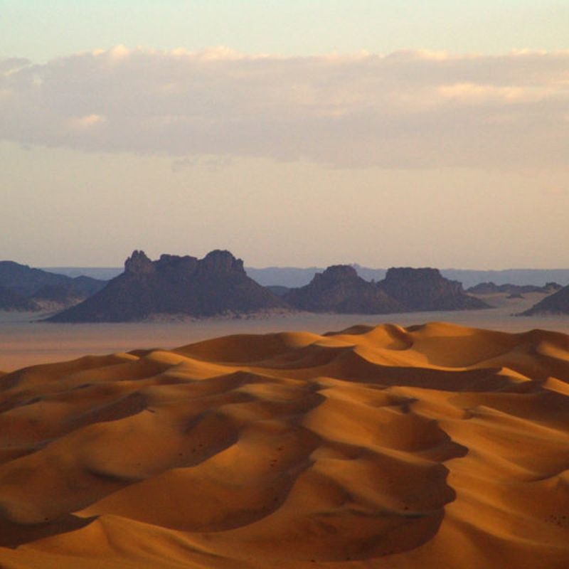 A desert landscape with mountains in the background. 
Algeria delivers extraordinary contrasts—Sahara dunes, Mediterranean coastlines, thriving cities, and timeless cultural treasures all in one unforgettable destination.
Travel with Africa DMC’s trusted network for your local tour operator and travel agent to discover the true essence of Algeria.
