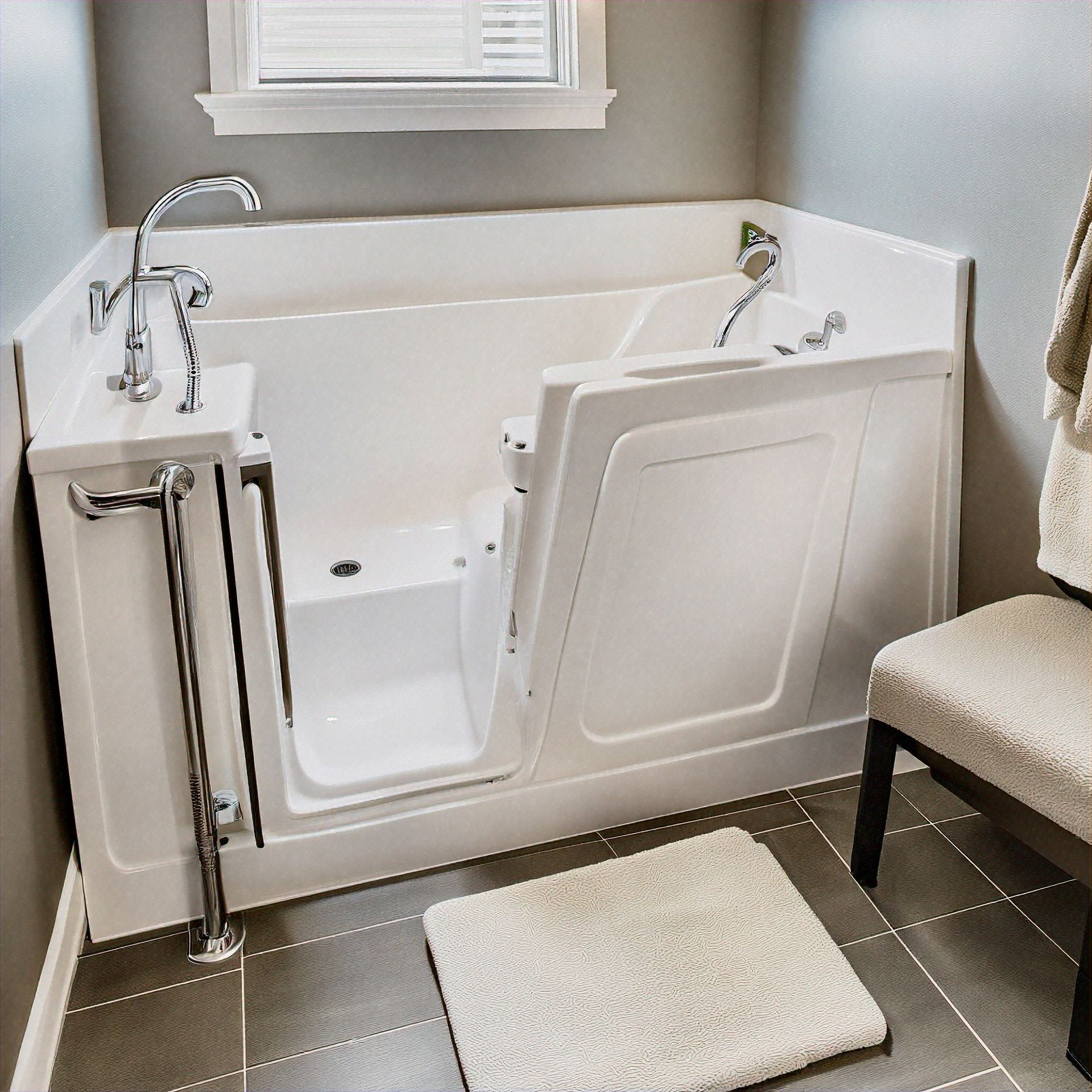 A bathroom with a walk in tub and a chair