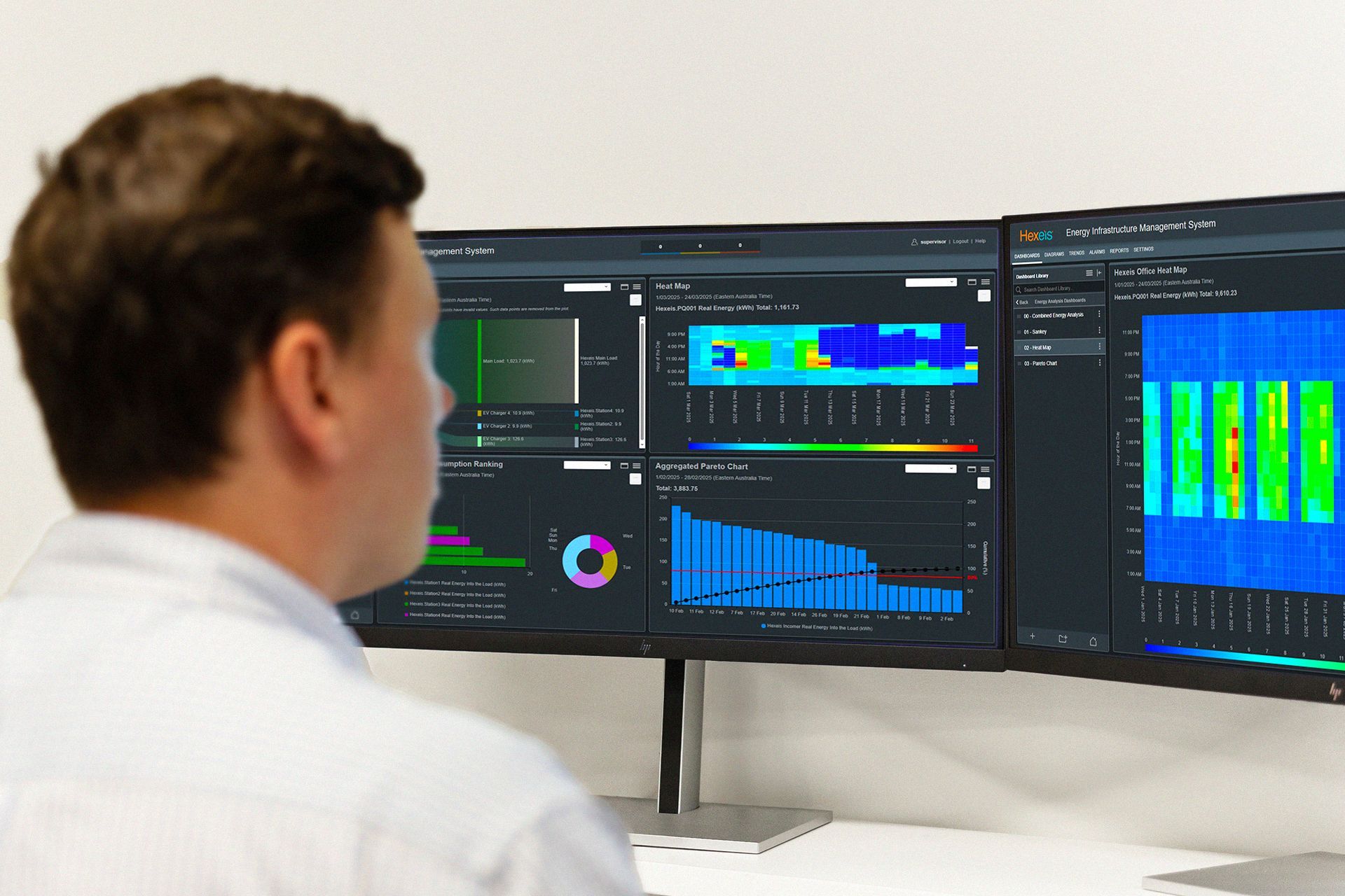 A Hexeis team member reviewing real time energy data via the Hexeis Energy Infrastructure Management System