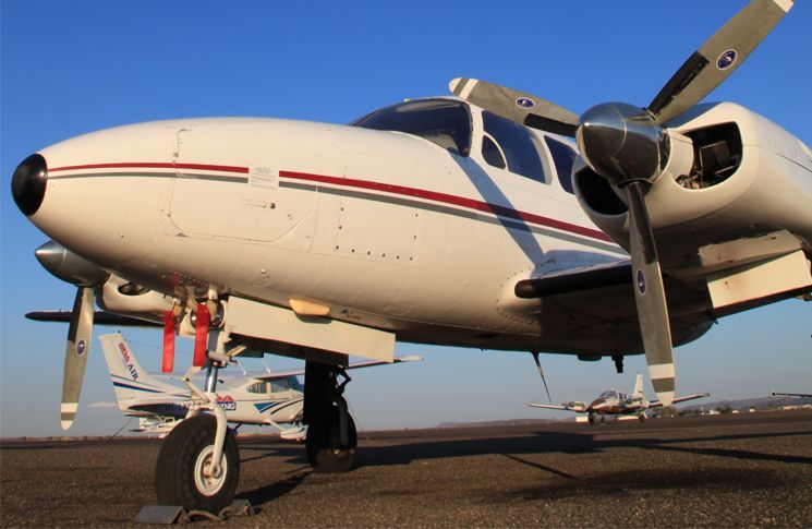a twin engine aircraft ready to deliver an exclusive air cargo courier shipment