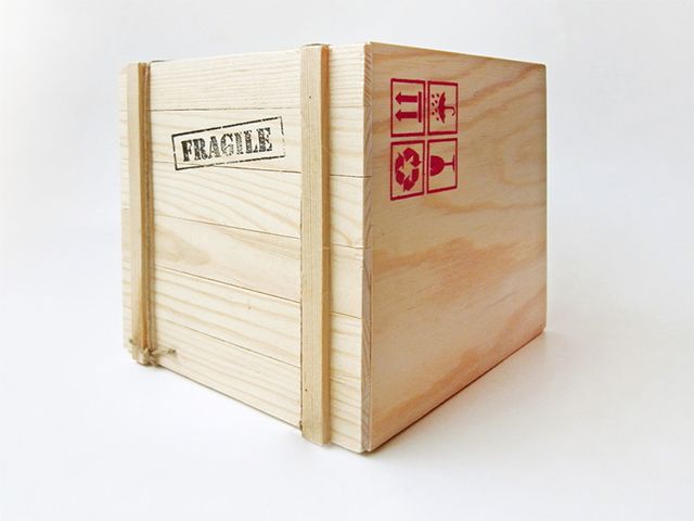 a crated box containing a fragile shipment