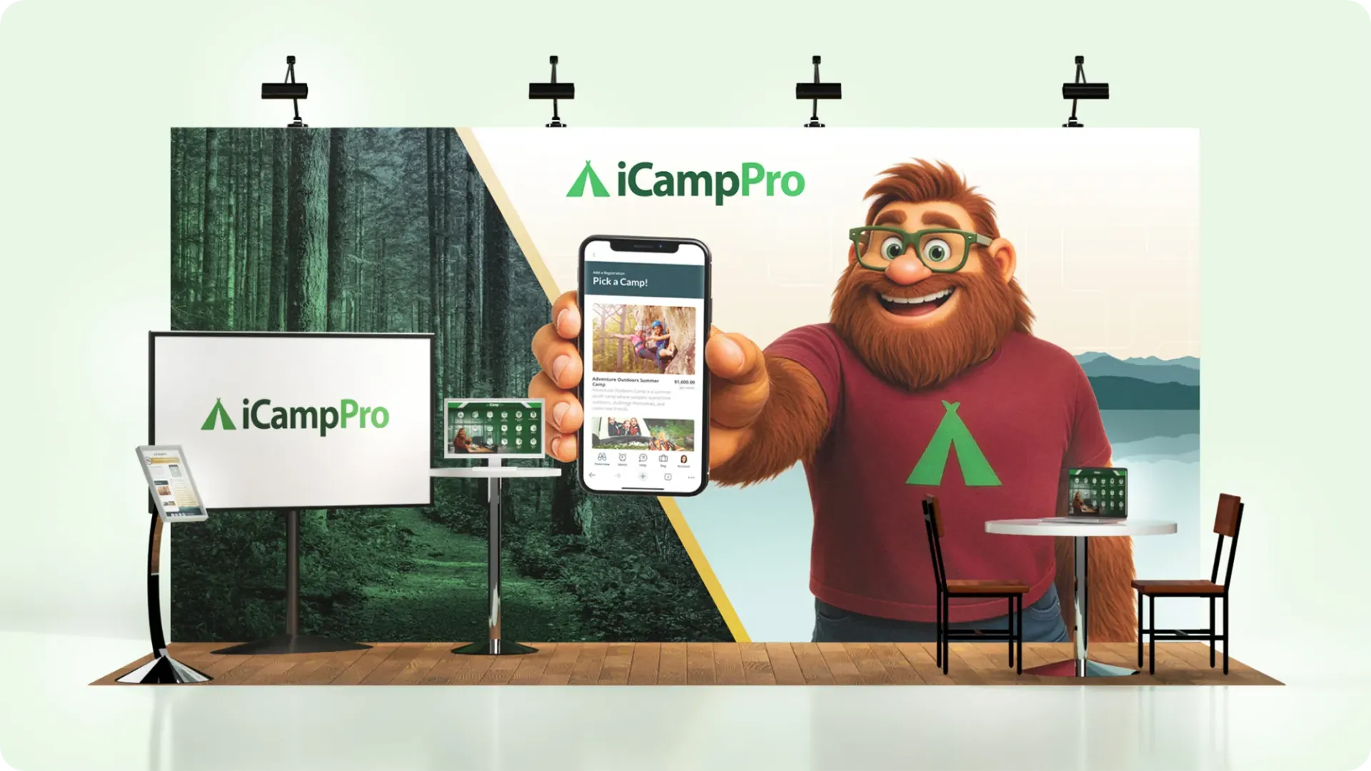 ICampPro booth: Animated bearded man holding phone showing app. Forest backdrop, logo, tables, and screens.