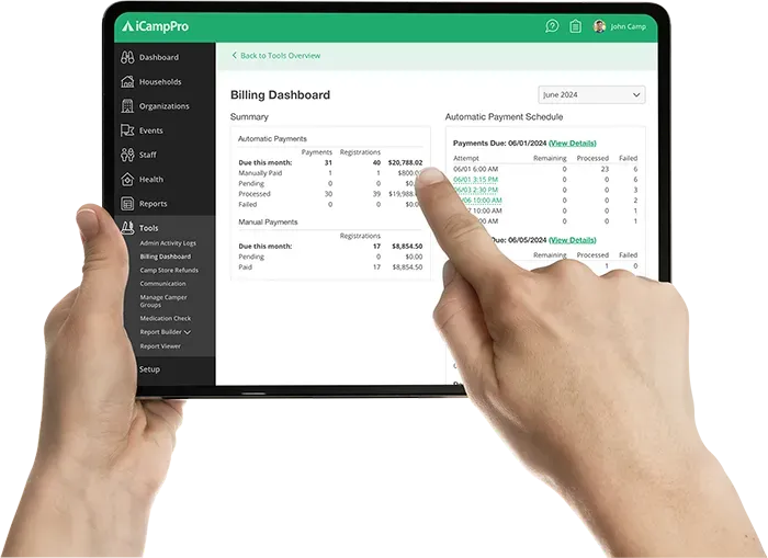 A person is holding a tablet in their hands and pointing at the screen.