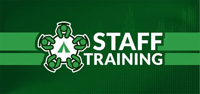 A green background with the words staff training on it.