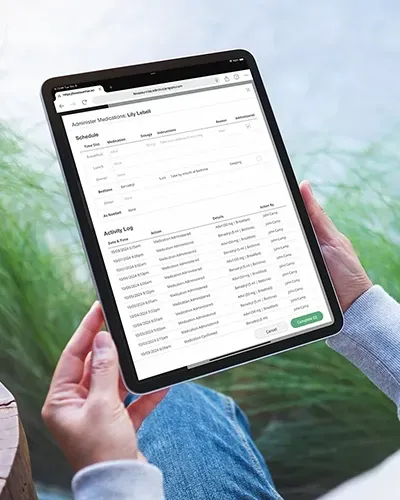 A person is holding a tablet in their hands.