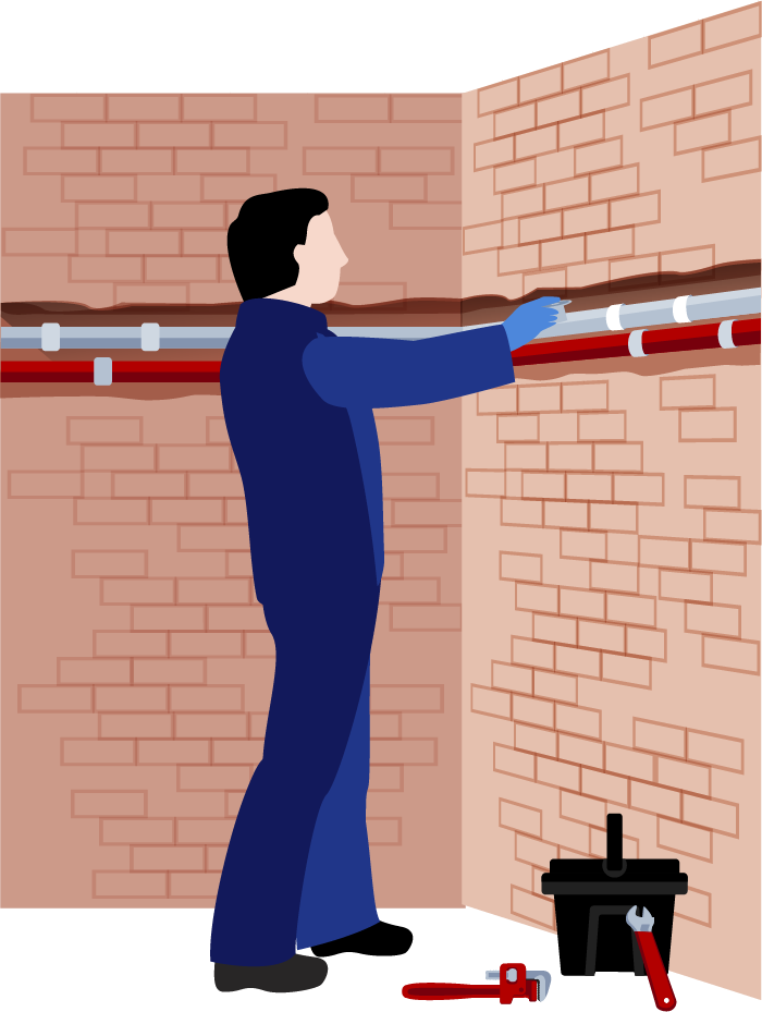 Ein Mann arbeitet an einem Rohr in einem Raum mit einer Ziegelwand