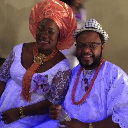 A man and a woman are posing for a picture