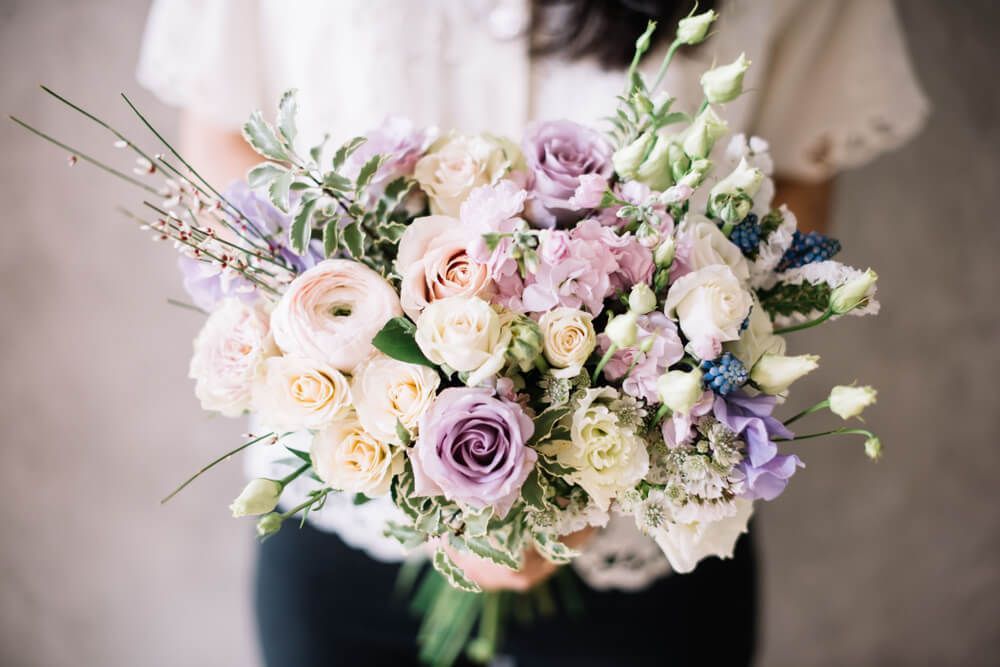 Woman Holding Blossoming Flower Bouquet — Castletown Flower Hut in Pimlico, QLD