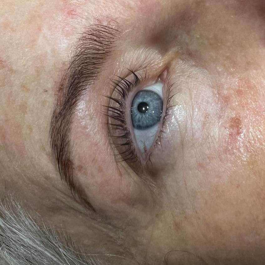 A close up Of a Woman's Face with tinted eyelashes and trimmed eyebrows— Ammo Hair and Beauty In Maclean, NSW
