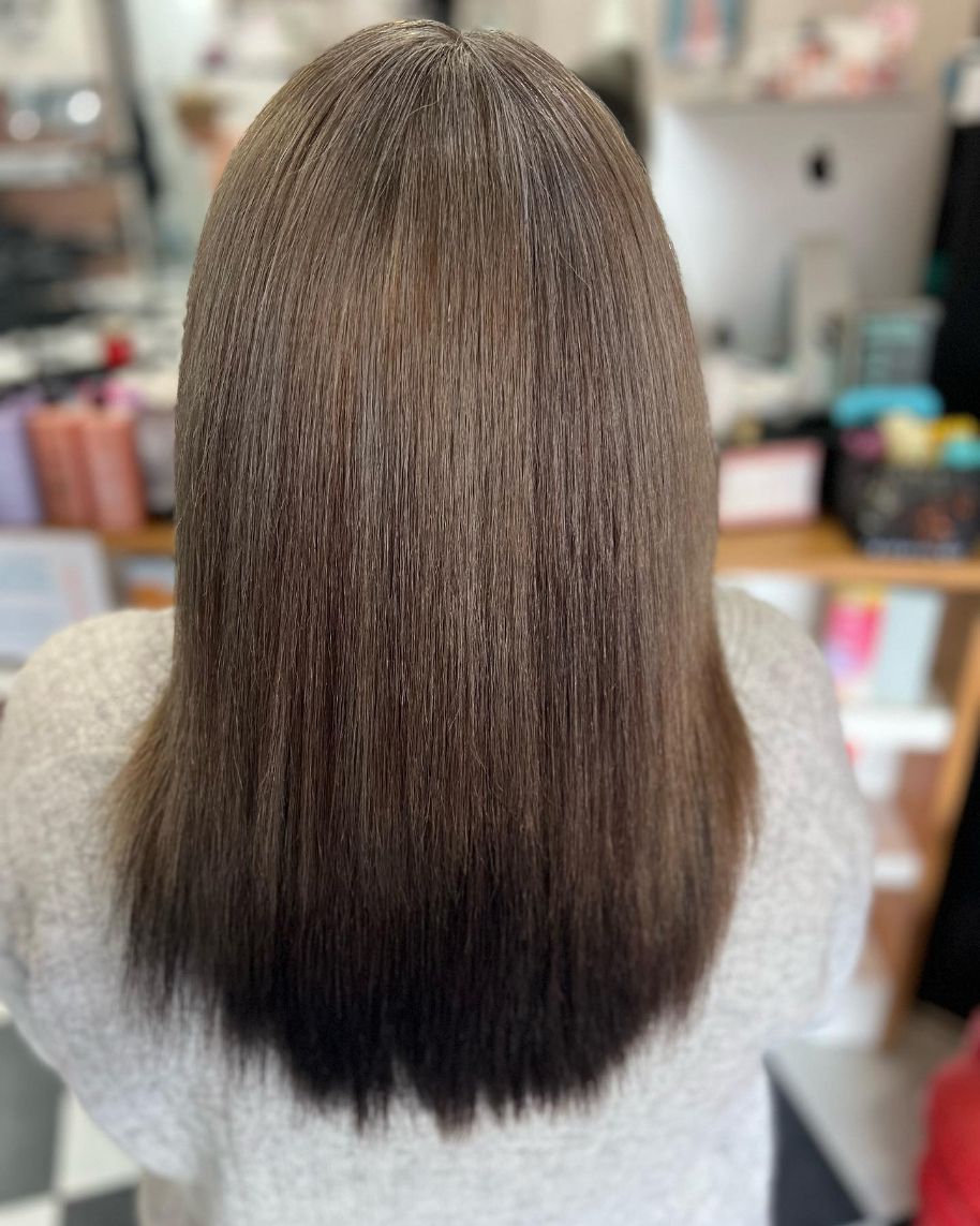 The Back of A Woman 's Hair Is Shown in A Salon — Ammo Hair and Beauty In Maclean, NSW