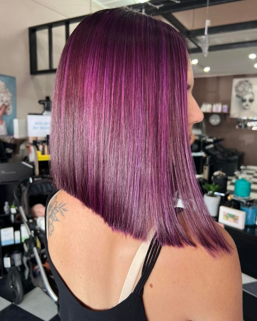 A Woman with Purple Hair Is Wearing a Black Tank Top — Ammo Hair and Beauty In Maclean, NSW