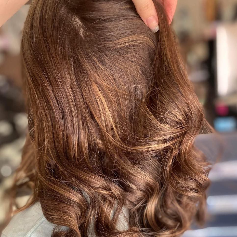 A Woman Is Getting Her Hair Done in A Salon — Ammo Hair and Beauty In Maclean, NSW