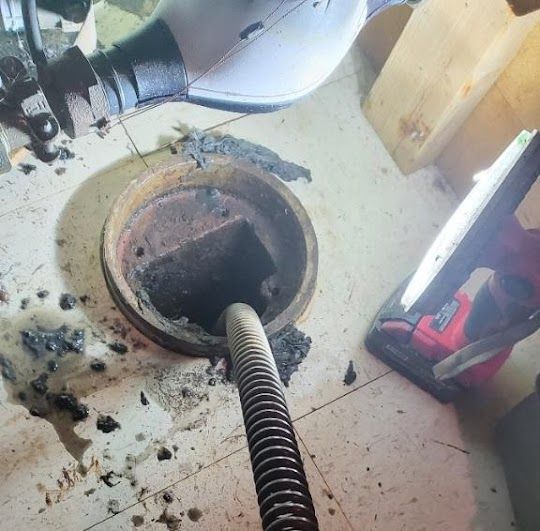 Mount Prospect Plumber cleaning a sewer drain.