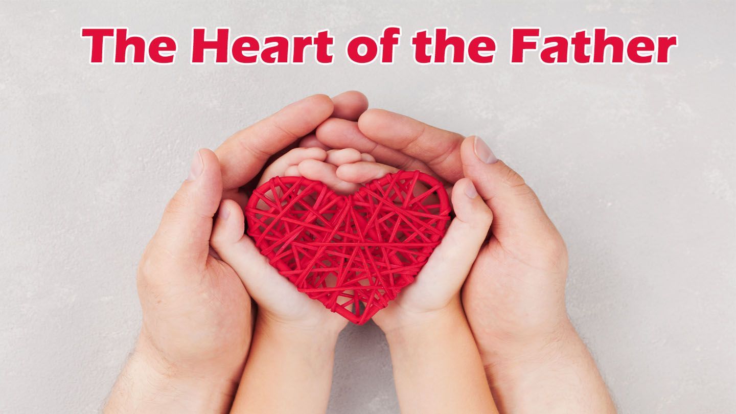 Hands of an adult and child cupping a red heart-shaped craft; text above: 