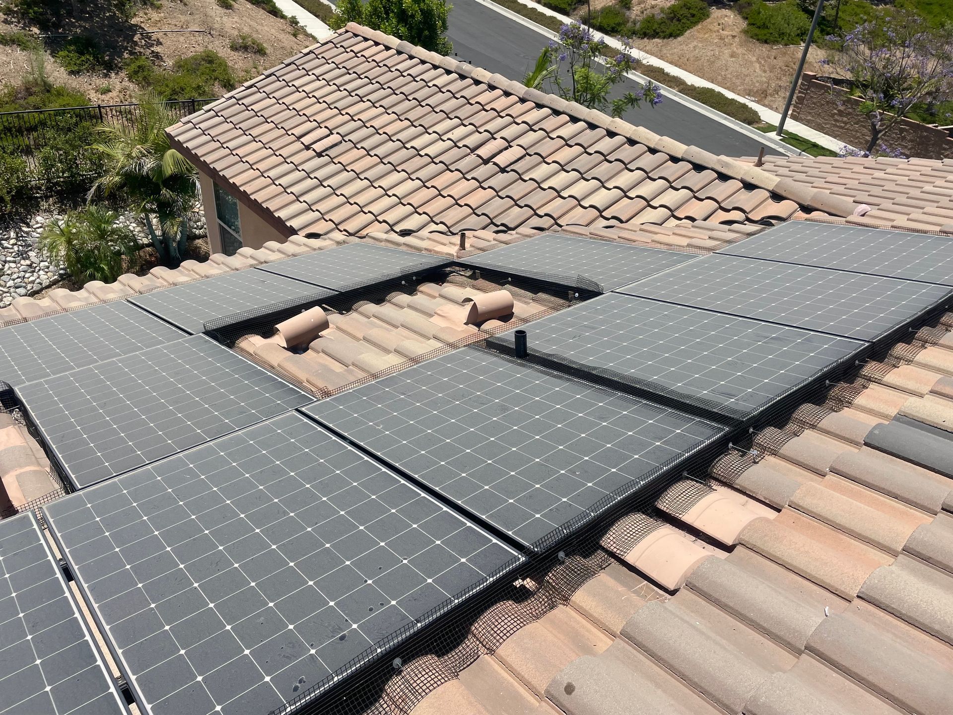 A roof with a lot of solar panels on it