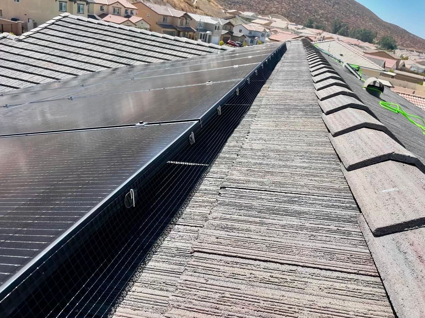 A roof with a lot of solar panels on it