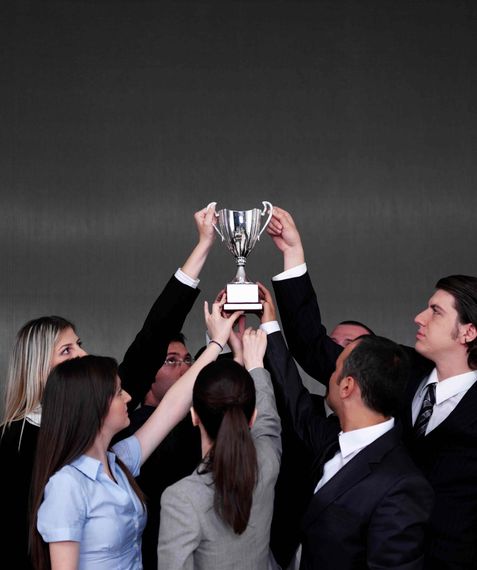 Business People Holding Up A Trophy — Richmond, VA — Bunkie Trinite Trophies Business People Holding Up A Trophy — Richmond, VA — Bunkie Trinite Trophies
