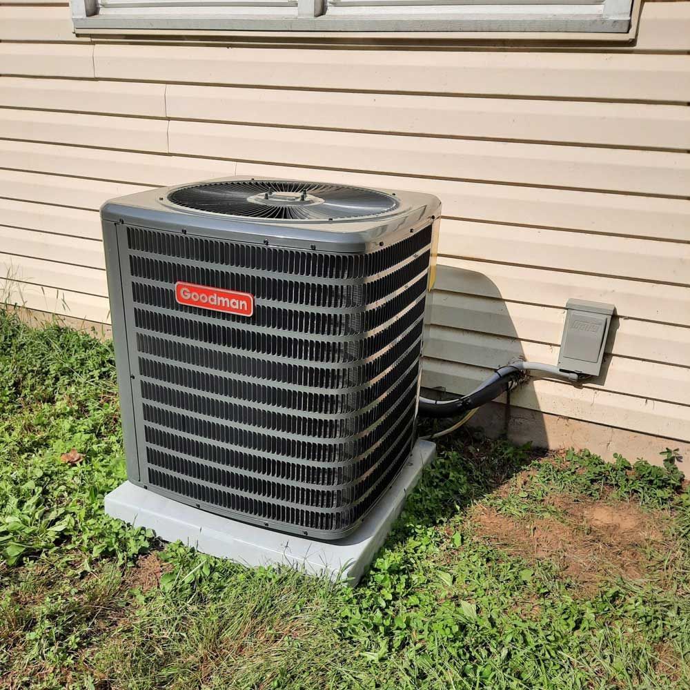 Goodman air conditioning unit installed outside a Delaware County home
