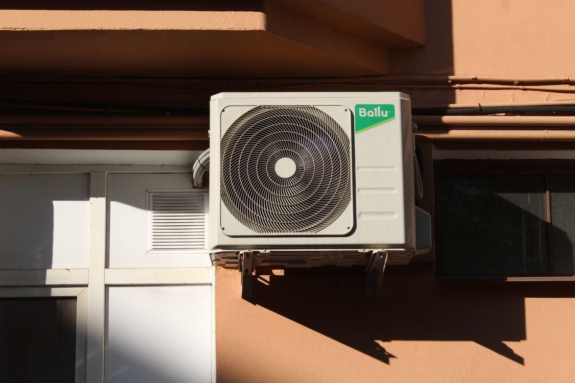 A wall-mounted AC condenser.