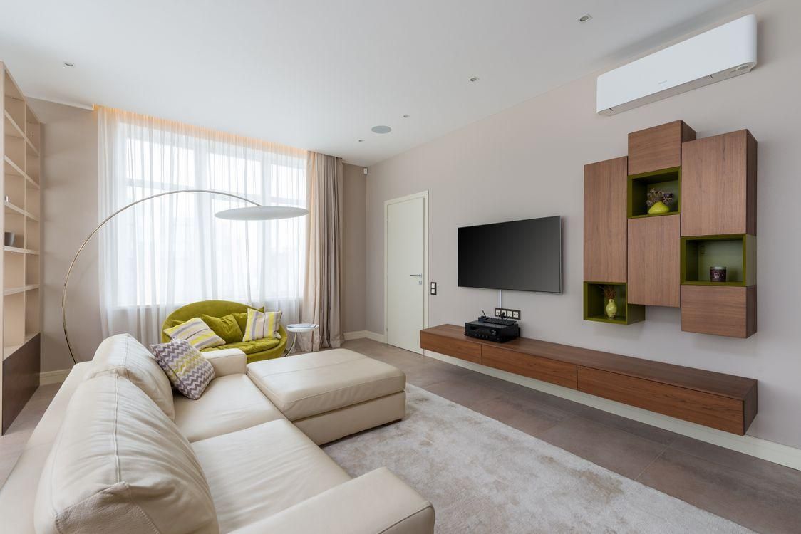 A living room with a functional AC
