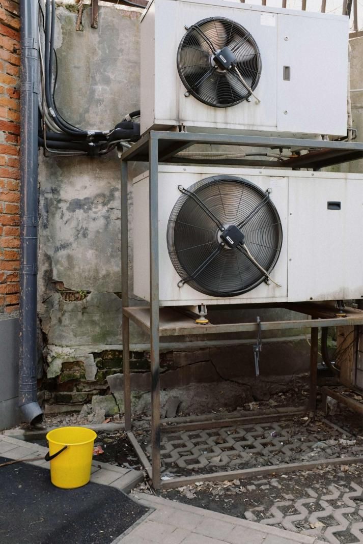External units of an air condition system installed on a metal frame outside of a building